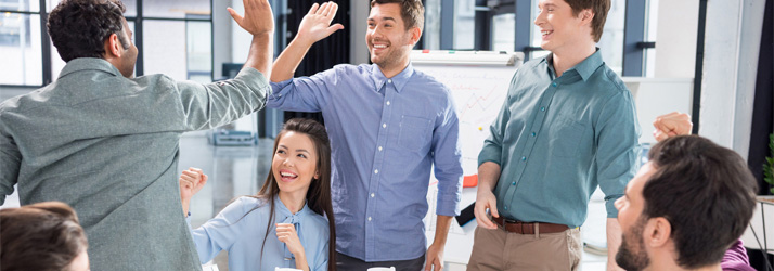 Chiropractic Wichita KS Wellness Workshop Dates Group Of Business People High-Fiving